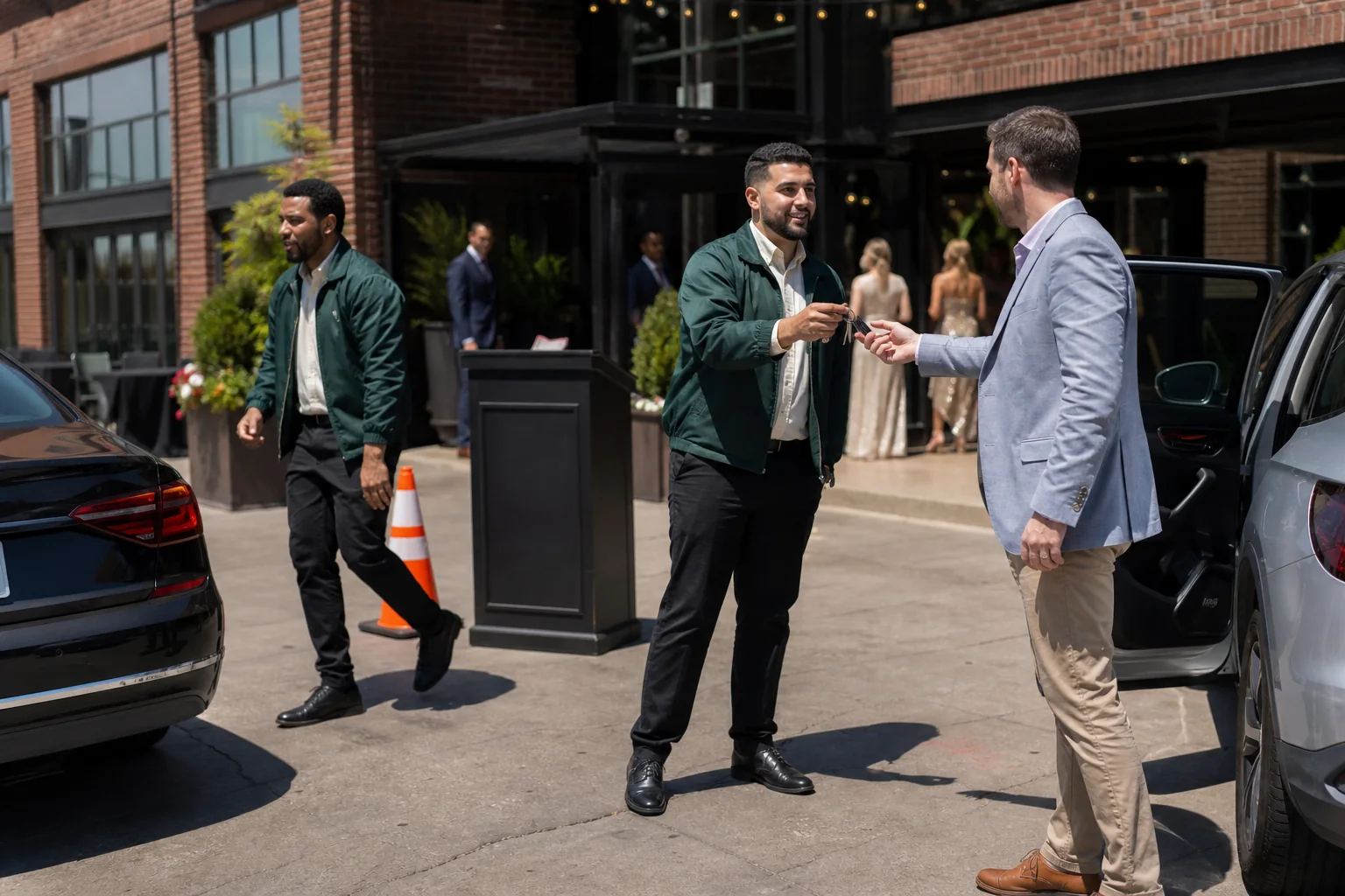 Two Valet Denver attendants coordinating arrivals at an event venue